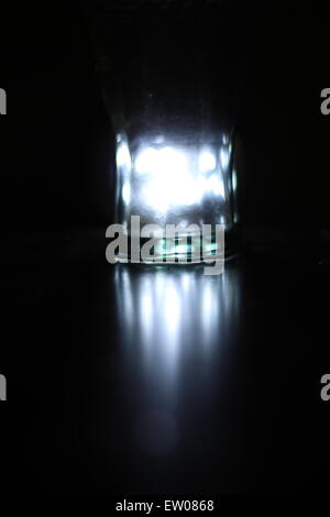 Light shines through glass, reflecting wherever it can. Stock Photo