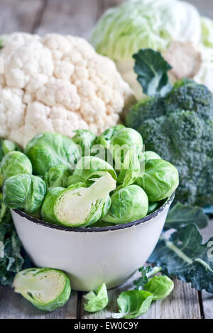 Assortment of cabbages on old wood background Stock Photo