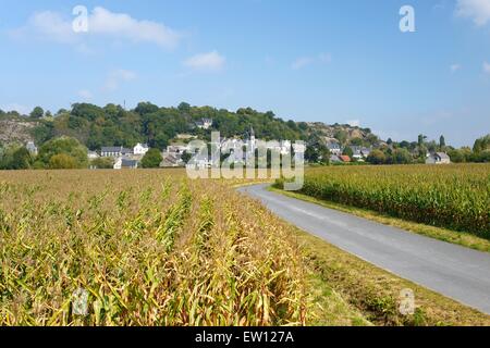 East over cornfields to granite hill and village of Mont Dol. Near Saint Malo and town of Dol-de-Bretagne, Brittany, France Stock Photo