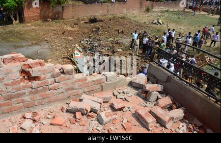 Allahabad, India. 16th June, 2015. A house practically collapsed due to a Jaguar fighter aircraft of the Indian Air Force crashed this morning at Chaka in Naini near Allahabad in Uttar Pradesh. Both the pilots managed to eject safely. The plane which had taken off at 7:25 am from the Bamrauli air strip in Allahabad was on a routine training sortie. The pilots reportedly sent signals to the ground staff that there was some major technical glitch with the aircraft. © Prabhat Kumar Verma/Pacific Press/Alamy Live News Stock Photo