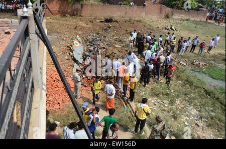 Allahabad, India. 16th June, 2015. Officers inspecting after a Jaguar fighter aircraft of the Indian Air Force crashed this morning at Chaka in Naini near Allahabad in Uttar Pradesh. Both the pilots managed to eject safely. The plane which had taken off at 7:25 am from the Bamrauli air strip in Allahabad was on a routine training sortie. The pilots reportedly sent signals to the ground staff that there was some major technical glitch with the aircraft. © Prabhat Kumar Verma/Pacific Press/Alamy Live News Stock Photo