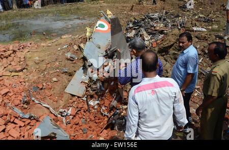 Allahabad, India. 16th June, 2015. Officers inspecting after a Jaguar fighter aircraft of the Indian Air Force crashed this morning at Chaka in Naini near Allahabad in Uttar Pradesh. Both the pilots managed to eject safely. The plane which had taken off at 7:25 am from the Bamrauli air strip in Allahabad was on a routine training sortie. The pilots reportedly sent signals to the ground staff that there was some major technical glitch with the aircraft. © Prabhat Kumar Verma/Pacific Press/Alamy Live News Stock Photo