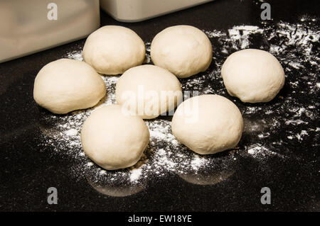 Dough balls rising to make rolls or bagels Stock Photo