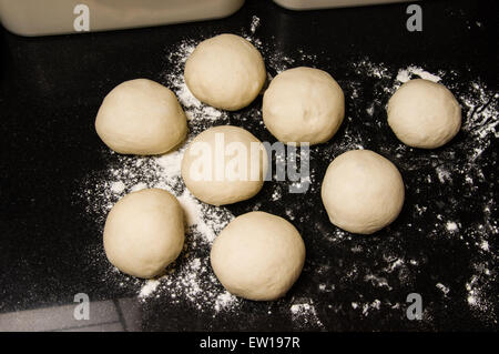 Dough balls rising to make rolls or bagels Stock Photo