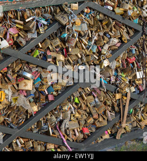 Padlocks fastened  to the railing of the Pont des Arts in Paris, France Stock Photo