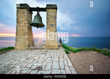 Big bell on sea shore. Nature composition. Stock Photo