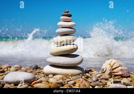 Stone pyramid on a seashore. Relax composition. Stock Photo