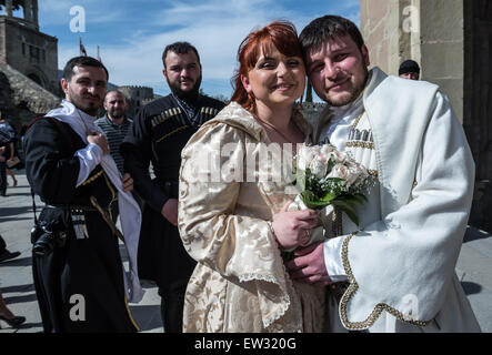 Wedding couple in traditional national costumes in Georgian Orthodox Svetitskhoveli (Living Pillar) Cathedral, Mtskheta, Georgia Stock Photo