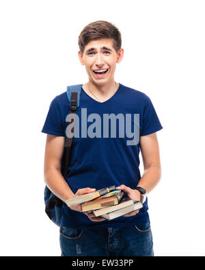 Laughing male student holding books isolated on a white background Stock Photo