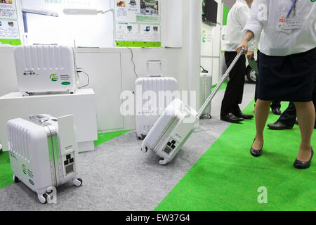 Tokyo, Japan. 17th June, 2015. An exhibitor shows a portable ''L-battery'' at the Smart Community Japan 2015 in exhibition in Tokyo, Big Sight on June 17, 2015, Tokyo, Japan. The exhibition promotes both domestic and overseas next-generation technologies. The last year 39,879 visitors attend the expo during three days. This year 233 enterprises and organizations will show their products from June 17th to 19th. Credit:  Rodrigo Reyes Marin/AFLO/Alamy Live News Stock Photo