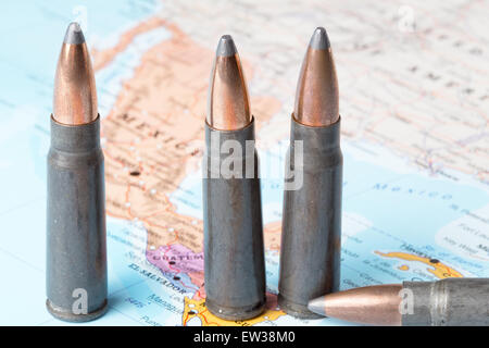 Four bullets on the geographical map of Mexico. Conceptual image for war, conflict, violence. Stock Photo