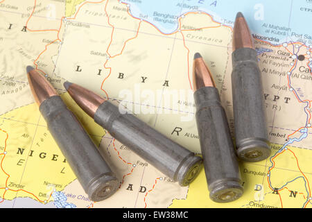 Four bullets on the geographical map of Libya. Conceptual image for war, conflict, violence. Stock Photo