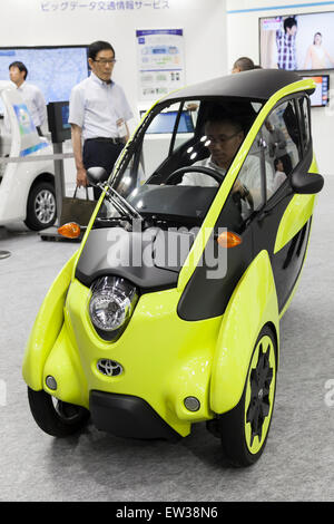 Tokyo, Japan. 17th June, 2015. A visitor tries an electric vehicle of Toyota ''i-Road'' at the Smart Community Japan 2015 in exhibition in Tokyo, Big Sight on June 17, 2015, Tokyo, Japan. The exhibition promotes both domestic and overseas next-generation technologies. The last year 39,879 visitors attend the expo during three days. This year 233 enterprises and organizations will show their products from June 17th to 19th. Credit:  Rodrigo Reyes Marin/AFLO/Alamy Live News Stock Photo