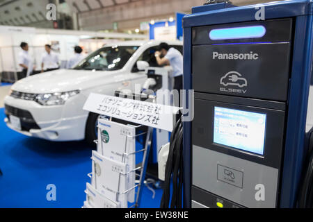 Tokyo, Japan. 17th June, 2015. A Panasonic electric vehicle charging on display at the Smart Community Japan 2015 in exhibition in Tokyo, Big Sight on June 17, 2015, Tokyo, Japan. The exhibition promotes both domestic and overseas next-generation technologies. The last year 39,879 visitors attend the expo during three days. This year 233 enterprises and organizations will show their products from June 17th to 19th. Credit:  Rodrigo Reyes Marin/AFLO/Alamy Live News Stock Photo