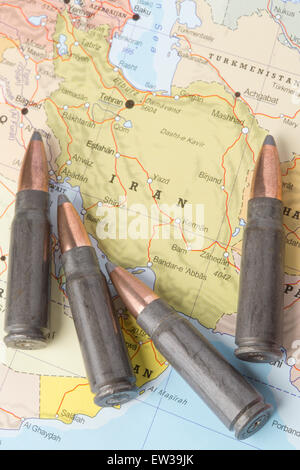 Four bullets on the geographical map of Iran. Conceptual image for war, conflict, violence. Stock Photo