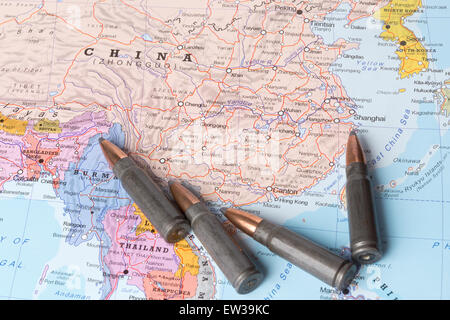 Four bullets on the geographical map of China. Conceptual image for war, conflict, violence. Stock Photo