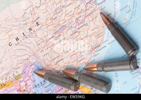 Four bullets on the geographical map of China. Conceptual image for war, conflict, violence. Stock Photo