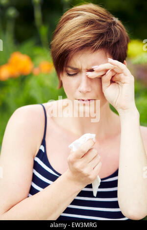 Girl with hayfever Stock Photo