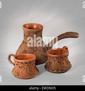 Brown clay coffee set with coffee pot and two cups Stock Photo