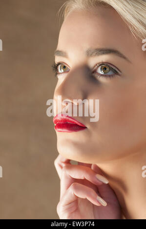 Thoughtful young woman looking away Stock Photo