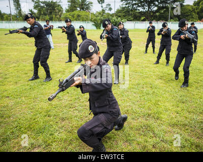 June 17, 2015 - Rangae, Narathiwat, Thailand - Thai women Rangers drill with HK33 Assault Rifles. There are 5 platoons of women Rangers serving in Thailand's restive Deep South. They generally perform security missions at large public events and do public outreach missions, like home wellness checks and delivering food and medicine into rural communities. The medics frequently work in civilian clothes because the Rangers found people are more relaxed around them when they're in civilian clothes. About 6,000 people have been killed in sectarian violence in Thailand's three southern provinces of Stock Photo