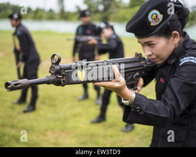 June 17, 2015 - Rangae, Narathiwat, Thailand - Thai women Rangers drill with HK33 Assault Rifles. There are 5 platoons of women Rangers serving in Thailand's restive Deep South. They generally perform security missions at large public events and do public outreach missions, like home wellness checks and delivering food and medicine into rural communities. The medics frequently work in civilian clothes because the Rangers found people are more relaxed around them when they're in civilian clothes. About 6,000 people have been killed in sectarian violence in Thailand's three southern provinces of Stock Photo