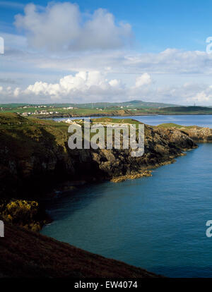 Looking west from the coastal path to Llanbadrig church, Cemaes, Anglesey, North Wales, UK: in early morning light. Stock Photo