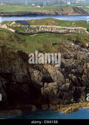 Looking west from the coastal path to Llanbadrig church, Cemaes in early morning light. Stock Photo