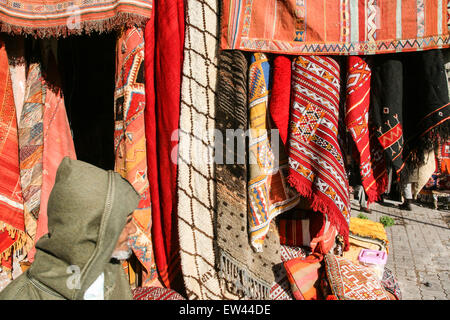 Colourful carpets for sale at this square, the Criee Berbere (carpet souk) one of the few open spaces amongst the maze of narrow Stock Photo