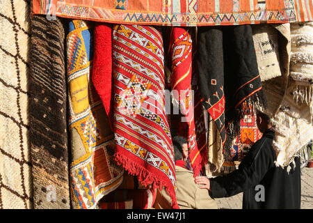 Colourful carpets for sale at this square, the Criee Berbere (carpet souk) one of the few open spaces amongst the maze of narrow Stock Photo