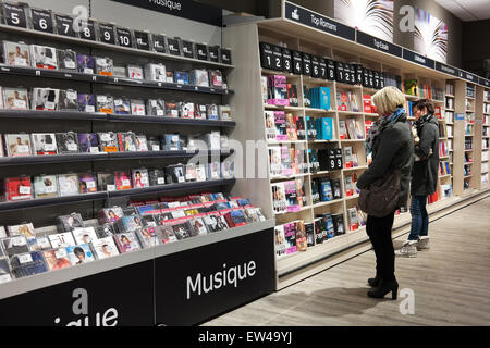 Customers in the media section in a Carrefour Hypermarket Stock Photo