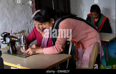 A teacher assisted her student in a sewing machine. A free vocational training provided by Sulabh international. Sulabh international aim to help to the victims economically to be strong this is also paying one thousand per month as a pension for being their helping hand. (Photo by Wasim Sarvar / Pacific Press) Stock Photo
