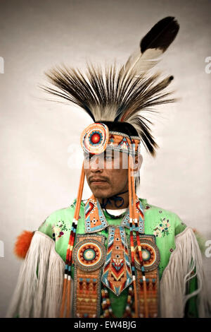 Portrait of a Native American man wearing an elaborate feather and bead headdress at a powwow in Post Fall Idaho. Stock Photo