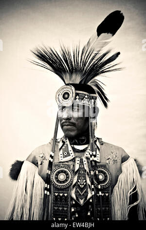 Portrait of a Native American man wearing an elaborate feather and bead headdress at a powwow in Post Fall Idaho. Stock Photo