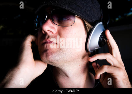Guy listening to music Carlsbad California. Stock Photo