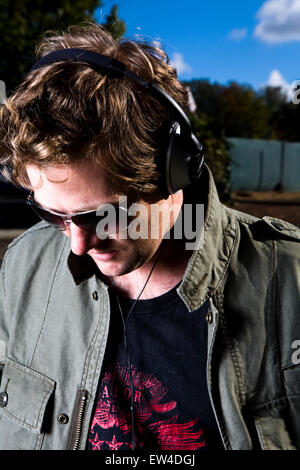 Guy listening to music Carlsbad California. Stock Photo