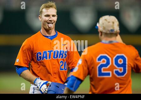 Florida Gators outfielder Harrison Bader (8) slides head first into second  base against the Miami Hurricanes in the NCAA College World Series on June  17, 2015 at TD Ameritrade Park in Omaha