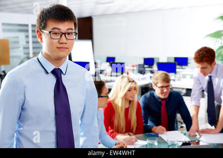 Asian executive young businessman portrait in office meeting Stock Photo