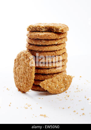 Digestive oat biscuits in a stack over white background Stock Photo