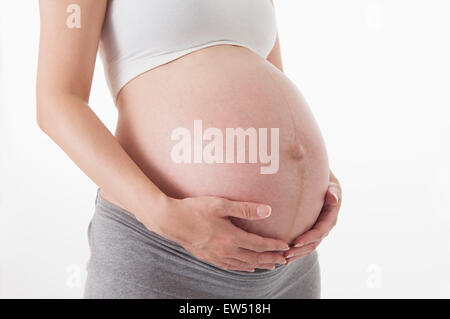 Close-up of pregnant woman's abdomen, Stock Photo
