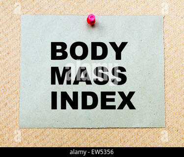 Body Mass Index written on paper note pinned with red thumbtack on wooden board. Business conceptual Image Stock Photo