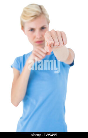 Stern blonde woman pointing with her finger Stock Photo