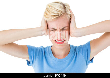 Furious blonde woman holding her head Stock Photo