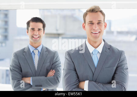 Two businessmen smiling at camera Stock Photo
