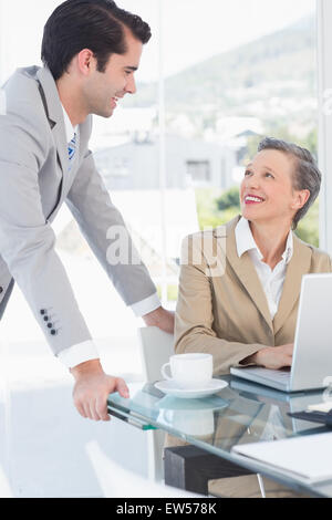 Business partners working on laptop Stock Photo