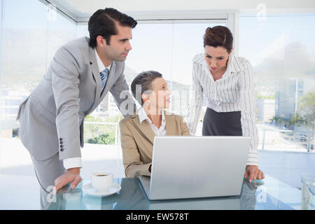 Business partners working on laptop Stock Photo