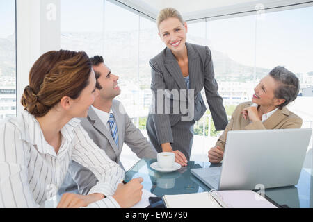 Business team working together on laptop Stock Photo