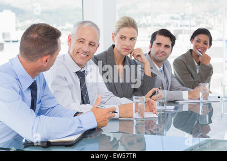 Business team having conversation at conference Stock Photo