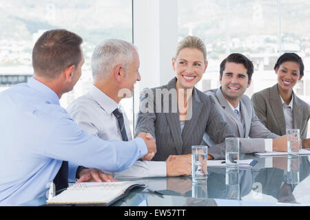 Business people shaking their hands Stock Photo