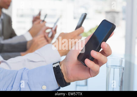 Business team using their mobile phone Stock Photo
